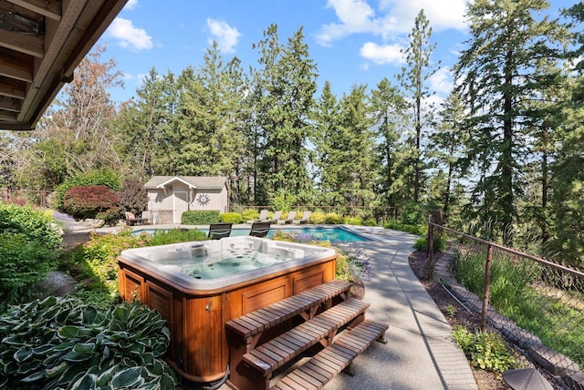 5321 Pinebrook Ct, Spokane, WA 99206 - view of patio / terrace featuring a hot tub, view of scattered trees, and an outdoor structure