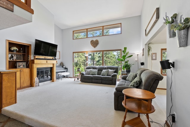 5321 Pinebrook Ct, Spokane, WA 99206 - carpeted living room with high vaulted ceiling and a fireplace with flush hearth