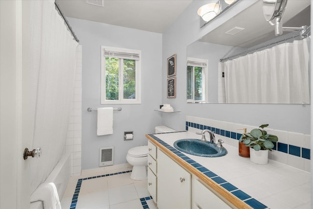 1501 S Maple St, Spokane, WA 99203 - bathroom with vanity, plenty of natural light, tile patterned floors, and heating unit