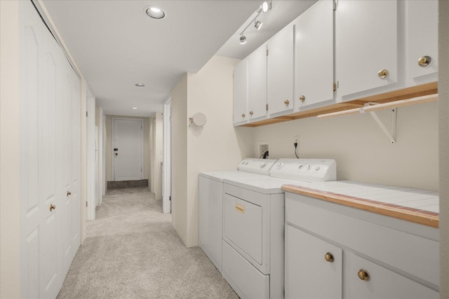 1501 S Maple St, Spokane, WA 99203 - laundry area featuring light carpet, cabinet space, washing machine and dryer, and recessed lighting