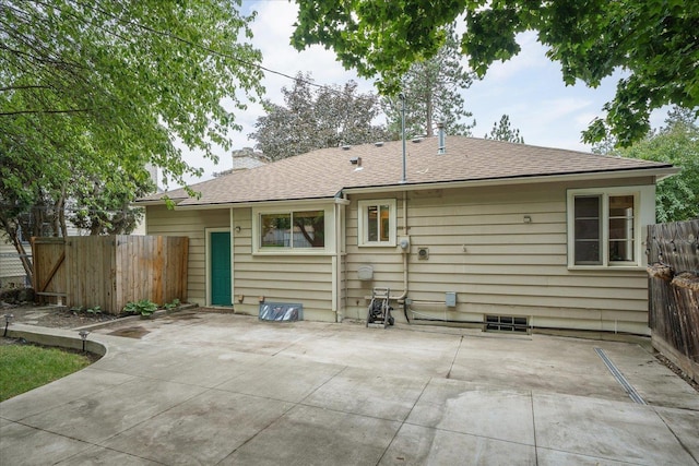 1501 S Maple St, Spokane, WA 99203 - back of house featuring a patio, a chimney, and roof with shingles