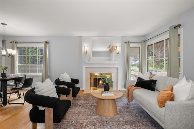 1501 S Maple St, Spokane, WA 99203 - living room featuring wood finished floors, a chandelier, and a fireplace