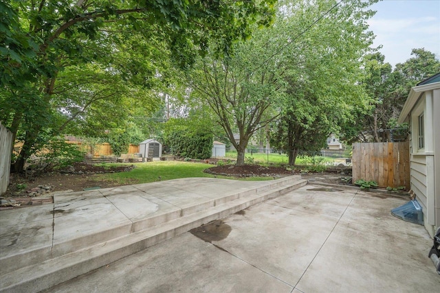 1501 S Maple St, Spokane, WA 99203 - fenced backyard with a storage shed and a patio