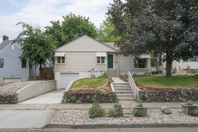 1501 S Maple St, Spokane, WA 99203 - view of front facade with concrete driveway, a garage, and a front yard