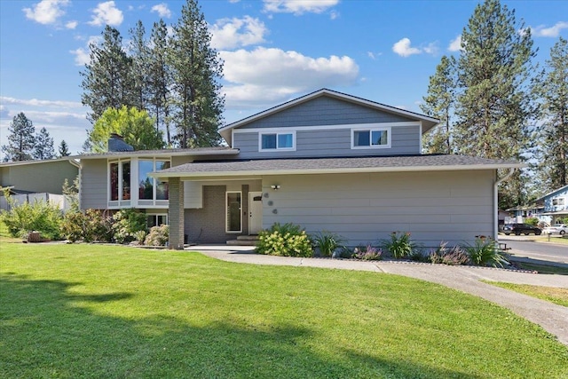 404 E Carriage Ct, Spokane, WA 99218 - view of front of home with a front yard and a chimney