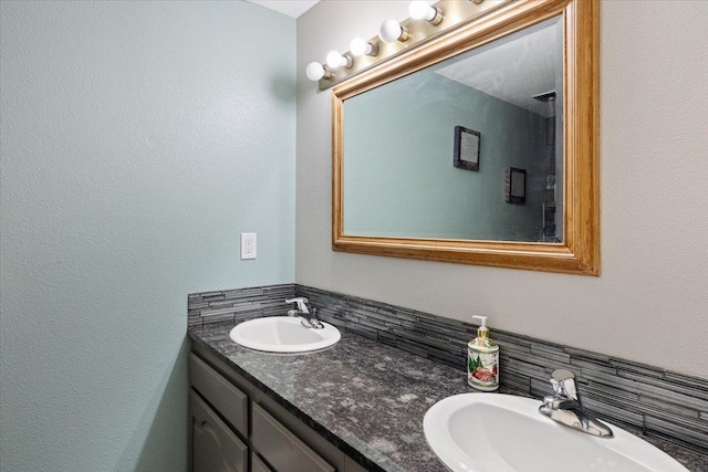 404 E Carriage Ct, Spokane, WA 99218 - bathroom with double vanity and tasteful backsplash