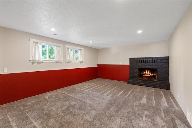 404 E Carriage Ct, Spokane, WA 99218 - below grade area with carpet floors, a brick fireplace, recessed lighting, and a textured ceiling