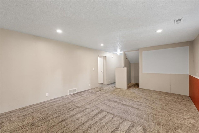 404 E Carriage Ct, Spokane, WA 99218 - finished basement with recessed lighting, light colored carpet, and a textured ceiling