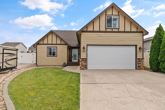 17309 E Baldwin Ave, Spokane Valley, WA 99016 - view of front of property with board and batten siding, a gate, a shingled roof, stone siding, and driveway