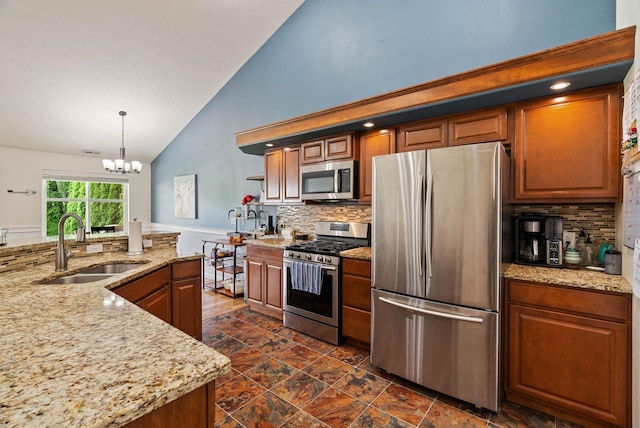 17309 E Baldwin Ave, Spokane Valley, WA 99016 - kitchen featuring appliances with stainless steel finishes, tasteful backsplash, a chandelier, high vaulted ceiling, and open shelves