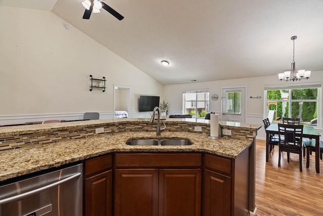 17309 E Baldwin Ave, Spokane Valley, WA 99016 - kitchen with stainless steel dishwasher, vaulted ceiling, light wood finished floors, a ceiling fan, and a chandelier