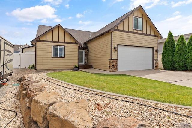 17309 E Baldwin Ave, Spokane Valley, WA 99016 - view of front facade featuring board and batten siding, a shingled roof, concrete driveway, stone siding, and a gate