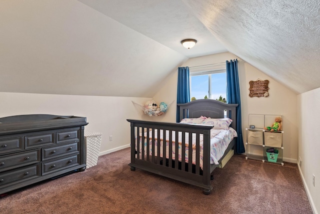 17309 E Baldwin Ave, Spokane Valley, WA 99016 - bedroom featuring vaulted ceiling, carpet floors, and a textured ceiling