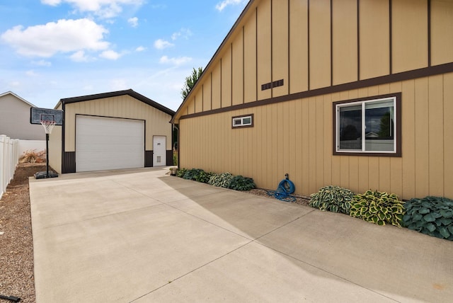 17309 E Baldwin Ave, Spokane Valley, WA 99016 - view of side of property featuring a garage, an outbuilding, and board and batten siding