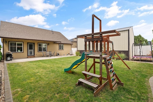 17309 E Baldwin Ave, Spokane Valley, WA 99016 - view of playground with a trampoline, a patio area, and a lawn