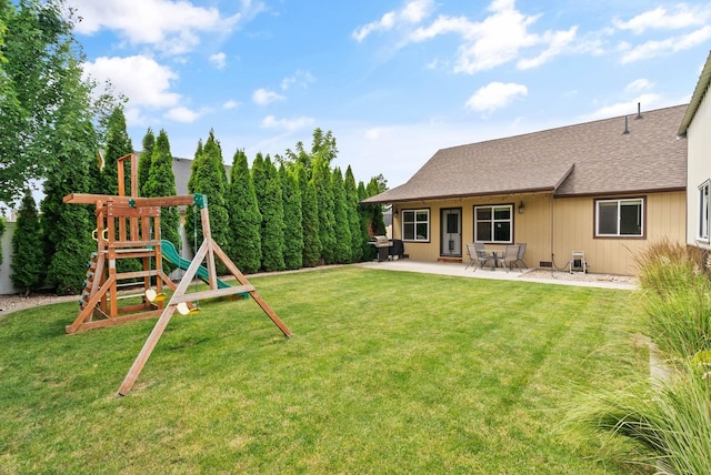 17309 E Baldwin Ave, Spokane Valley, WA 99016 - view of grassy yard with a playground and a patio