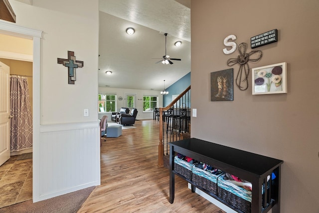 17309 E Baldwin Ave, Spokane Valley, WA 99016 - corridor featuring wainscoting, stairs, vaulted ceiling, and wood finished floors