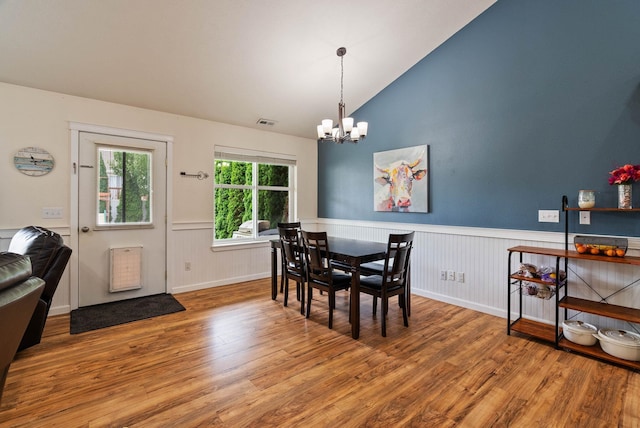 17309 E Baldwin Ave, Spokane Valley, WA 99016 - dining room with a chandelier, wood finished floors, wainscoting, and vaulted ceiling