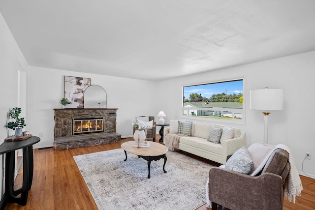 12024 E Buckeye Ave, Spokane Valley, WA 99206 - living area featuring wood finished floors and a stone fireplace