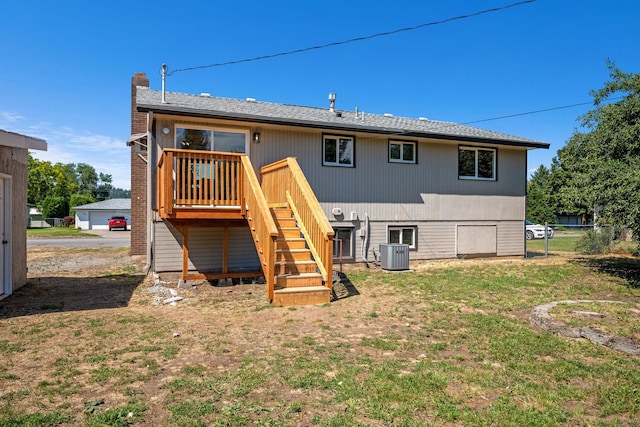 12024 E Buckeye Ave, Spokane Valley, WA 99206 - back of house with stairway, a chimney, a wooden deck, and a lawn