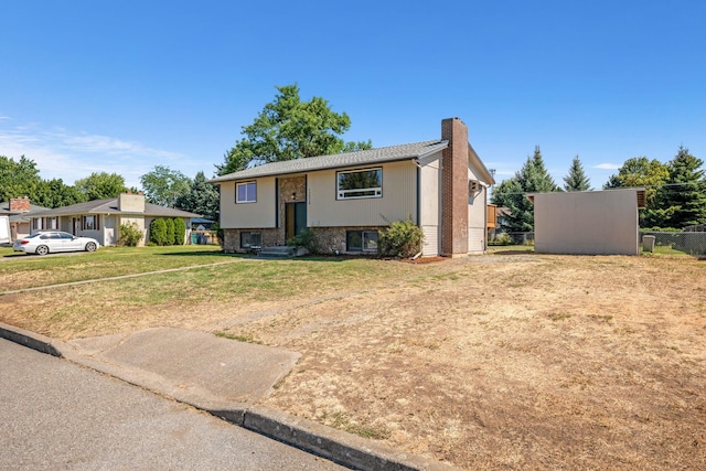 12024 E Buckeye Ave, Spokane Valley, WA 99206 - bi-level home with a chimney and a front yard