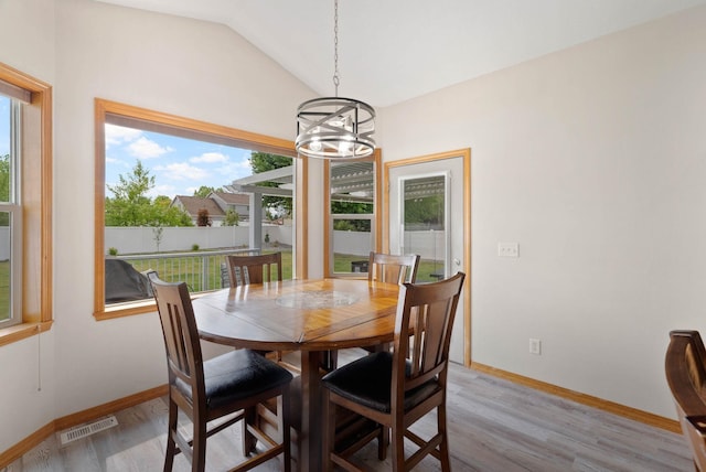 17110 E Daybreak Ln, Spokane Valley, WA 99016 - dining space with a chandelier, light wood-type flooring, and lofted ceiling
