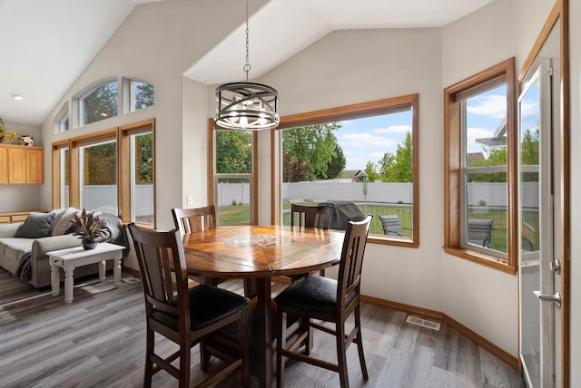 17110 E Daybreak Ln, Spokane Valley, WA 99016 - dining area with lofted ceiling, healthy amount of natural light, light wood-style floors, and a chandelier