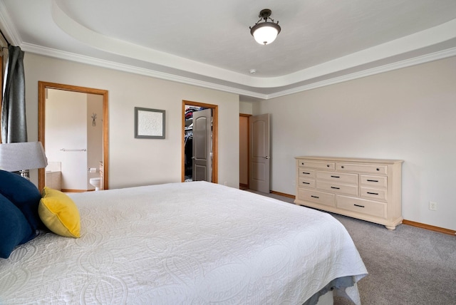 17110 E Daybreak Ln, Spokane Valley, WA 99016 - carpeted bedroom with a tray ceiling, ensuite bathroom, crown molding, and a walk in closet