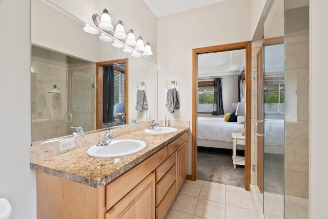 17110 E Daybreak Ln, Spokane Valley, WA 99016 - ensuite bathroom featuring tile patterned floors, a stall shower, and double vanity