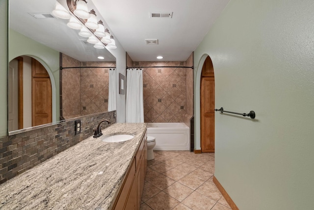 17110 E Daybreak Ln, Spokane Valley, WA 99016 - bathroom with vanity, tile patterned floors, backsplash, and shower / tub combo
