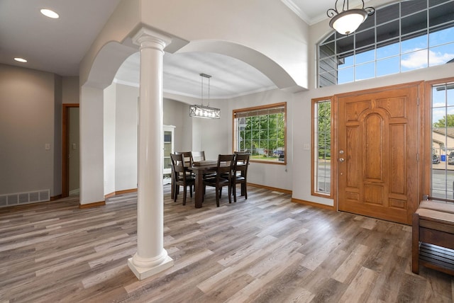 17110 E Daybreak Ln, Spokane Valley, WA 99016 - foyer entrance featuring crown molding, healthy amount of natural light, light wood-style floors, decorative columns, and recessed lighting