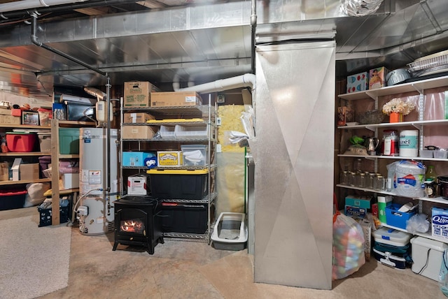17110 E Daybreak Ln, Spokane Valley, WA 99016 - unfinished basement with strapped water heater and a wood stove