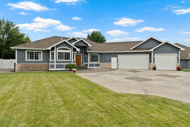 17110 E Daybreak Ln, Spokane Valley, WA 99016 - view of front of home featuring stone siding, a garage, driveway, and a shingled roof