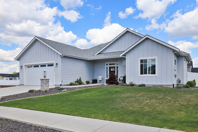 8510 N Jodi St, Spokane, WA 99208 - single story home with board and batten siding, an attached garage, a front yard, and concrete driveway