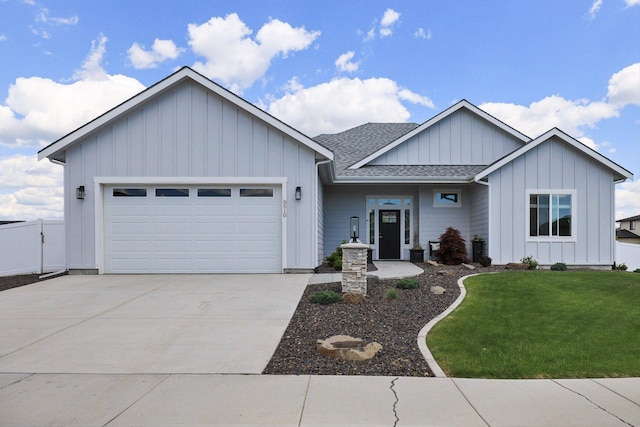 8510 N Jodi St, Spokane, WA 99208 - view of front facade featuring board and batten siding, concrete driveway, an attached garage, and roof with shingles