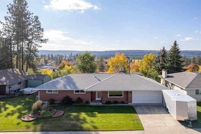 5801 N Drumheller St, Spokane, WA 99205 - single story home featuring driveway, a garage, and a front lawn