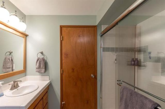 5801 N Drumheller St, Spokane, WA 99205 - bathroom featuring vanity and a shower with door