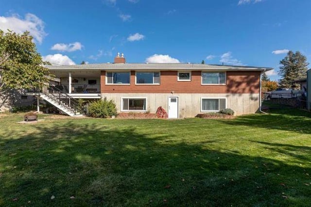 5801 N Drumheller St, Spokane, WA 99205 - rear view of property featuring stairs and a chimney