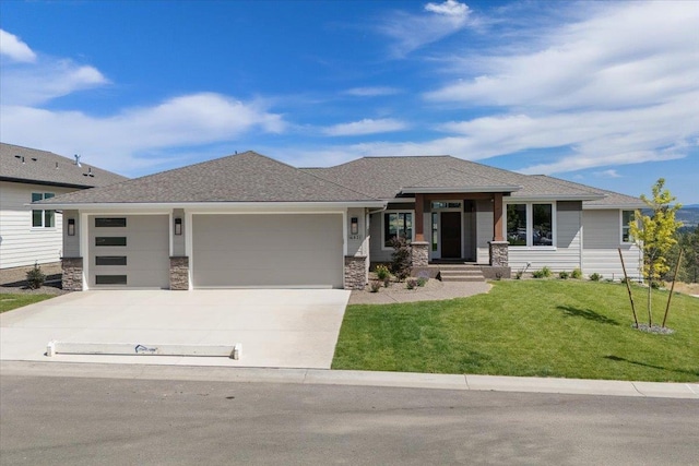 16931 E 16th Ln, Spokane Valley, WA 99037 - prairie-style home featuring stone siding, an attached garage, driveway, a front lawn, and roof with shingles