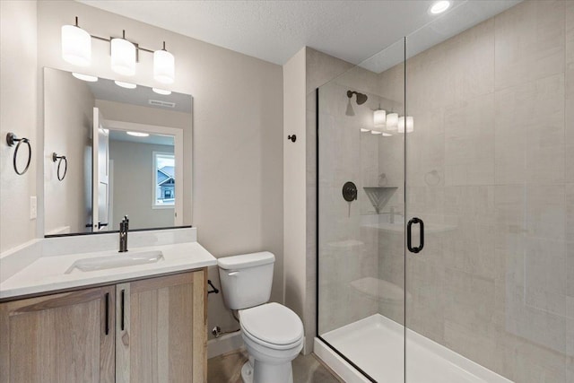 16931 E 16th Ln, Spokane Valley, WA 99037 - bathroom featuring a stall shower, vanity, and a textured ceiling