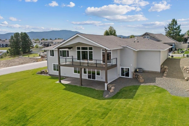 16931 E 16th Ln, Spokane Valley, WA 99037 - rear view of property with a patio area, a yard, a mountain view, and a balcony