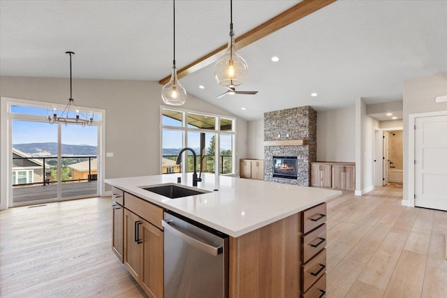 16931 E 16th Ln, Spokane Valley, WA 99037 - kitchen with dishwasher, light wood-style floors, ceiling fan, a stone fireplace, and recessed lighting