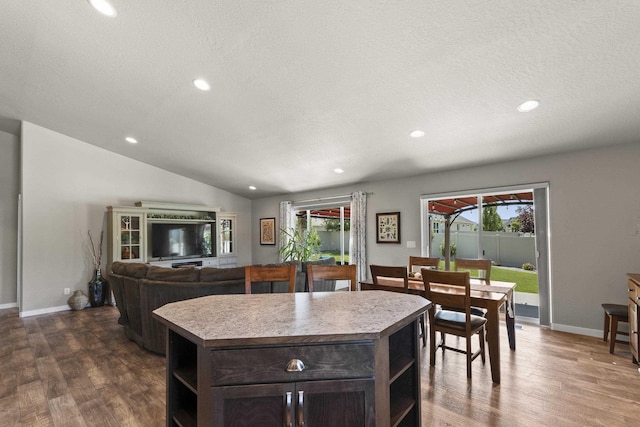 2373 N Colonial Rd, Liberty Lake, WA 99016 - kitchen featuring open shelves, dark wood-type flooring, a center island, dark brown cabinets, and recessed lighting