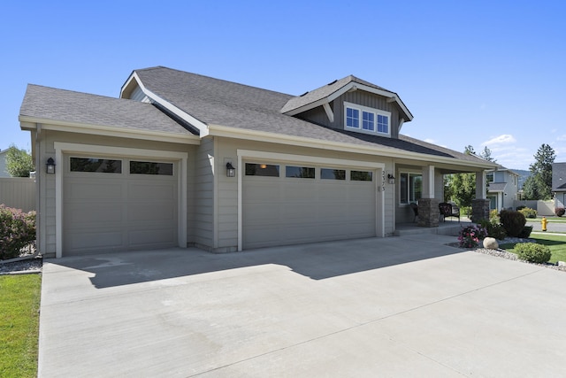 2373 N Colonial Rd, Liberty Lake, WA 99016 - view of front of house with driveway, an attached garage, and a shingled roof