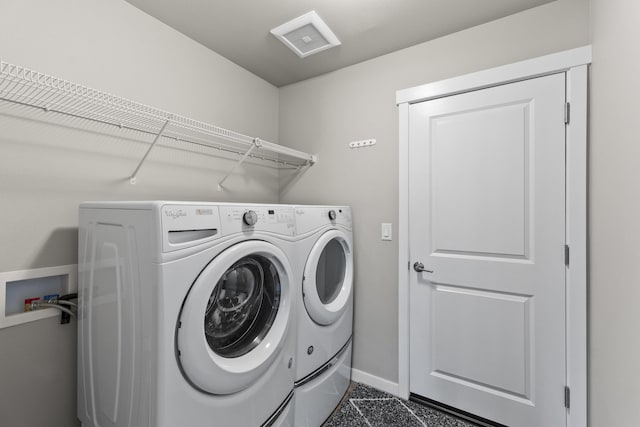 2373 N Colonial Rd, Liberty Lake, WA 99016 - laundry area with washing machine and clothes dryer and baseboards