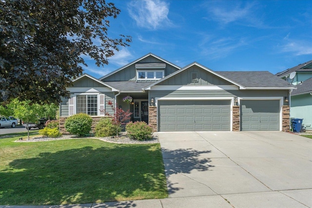 5916 S Division St, Spokane, WA 99224 - craftsman inspired home with stone siding, a front lawn, board and batten siding, concrete driveway, and an attached garage