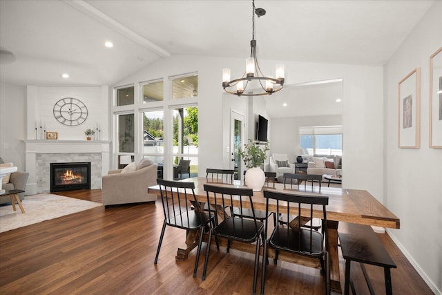 5916 S Division St, Spokane, WA 99224 - dining space featuring dark wood-style floors, a chandelier, a glass covered fireplace, beam ceiling, and recessed lighting