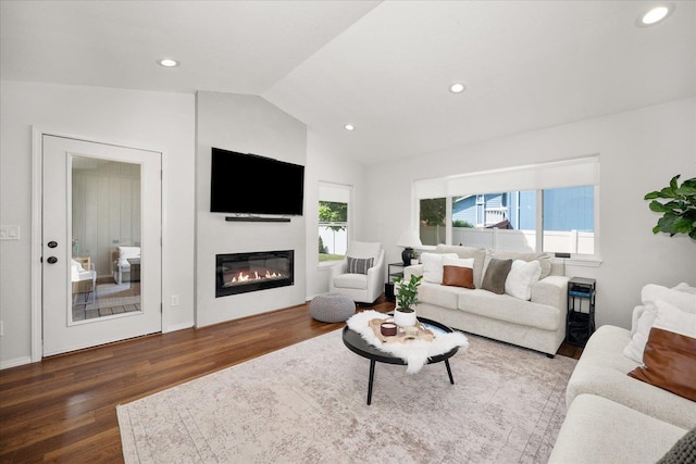 5916 S Division St, Spokane, WA 99224 - living area featuring wood finished floors, vaulted ceiling, a glass covered fireplace, and recessed lighting