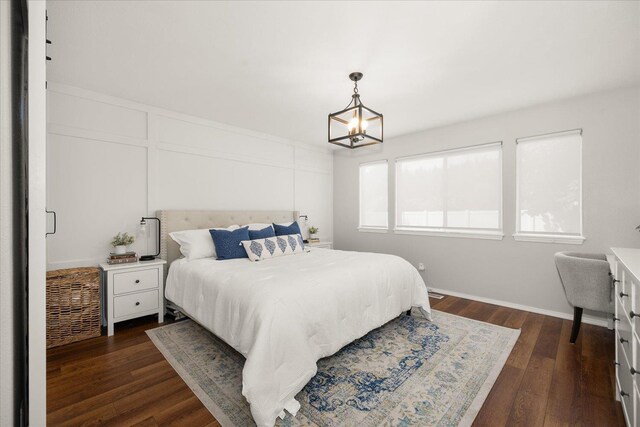 5916 S Division St, Spokane, WA 99224 - bedroom with a chandelier and dark wood-style flooring