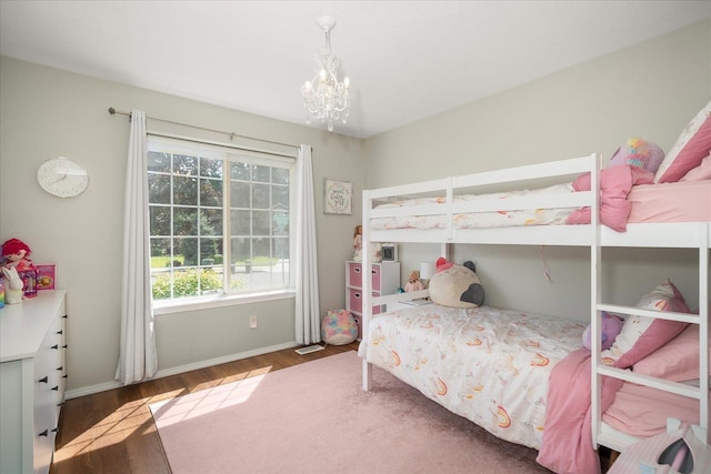 5916 S Division St, Spokane, WA 99224 - bedroom featuring wood finished floors and a chandelier